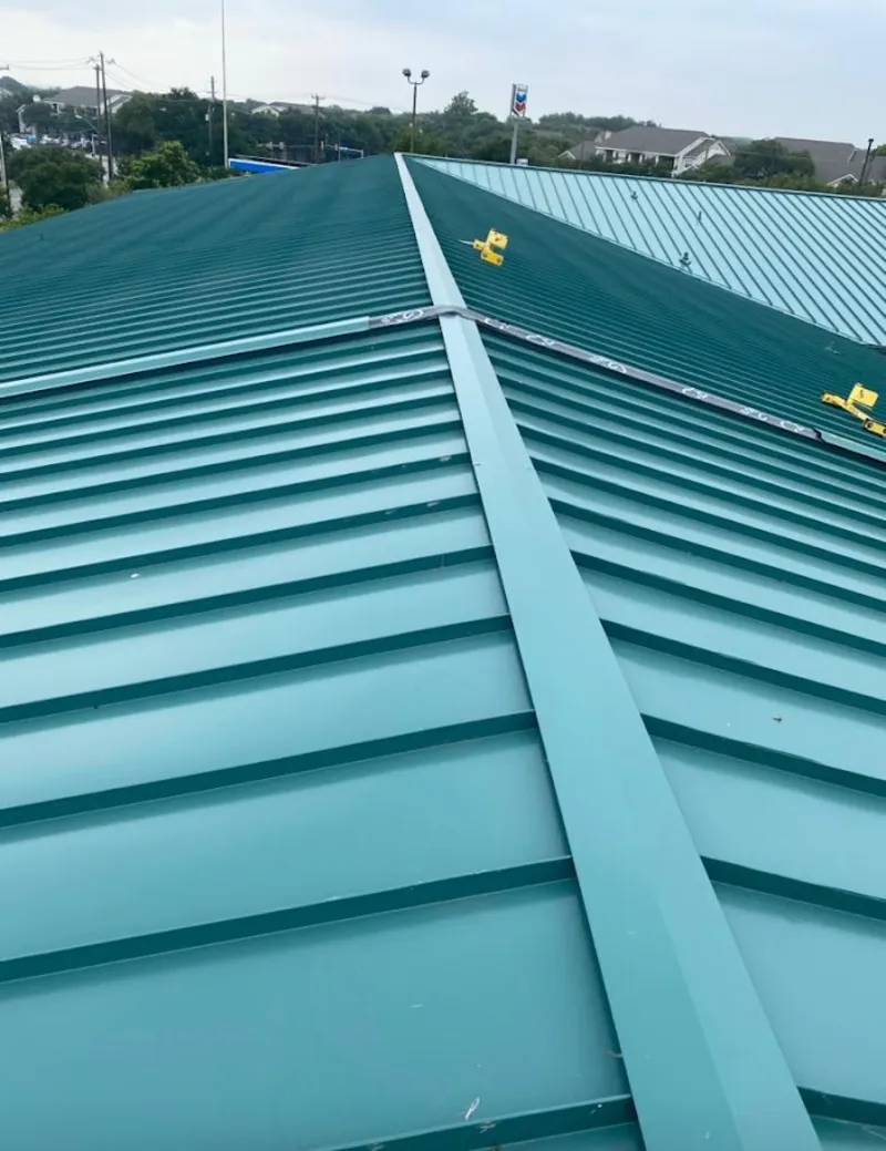 Green commercial metal roof ridge and valley for Metal Roof Repair in Andrews